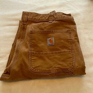 Carhartt men work pants. Definitely worn, A LOT of life left in them.